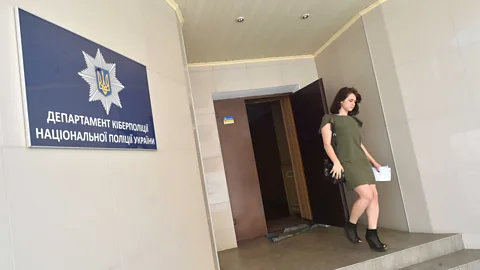 Getty Images An employee of Ukraine's Cyberpolice Department leaves the building in Kiev on 29 June 2017 (Credit: Getty Images)