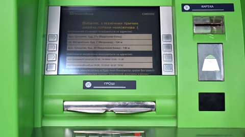 Getty Images A Ukrainian ATM belonging to Privat Bank reads 'Sorry for technical reasons, cash is not possible' (Credit: Getty Images)