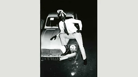 Malick Sidibé In Malick Sidibe’s pictures of well-dressed Malian men and women posing on bonnets, cars are status symbols (Credit: Malick Sidibé)