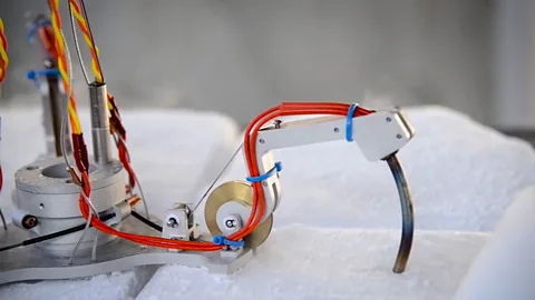 Nasa The liquid water will probably be reached by a robot drilling through the layers of ice (Credit: Nasa)