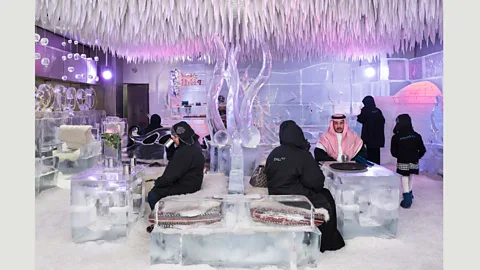 Nick Hannes Saudi tourists having a hot chocolate at the Chillout Ice Lounge, the first subzero ice lounge in the Middle East, 6 January 2016 (Credit: Nick Hannes)