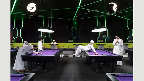 Nick Hannes Emirati boys playing a game of pool at City Walk shopping mall's gaming and entertainment complex Hub Zero, 5 January 2017 (Credit: Nick Hannes)