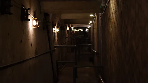 Amanda Ruggeri Today, the staircase to the air raid shelter and underground studios is eerie and empty (Credit: Amanda Ruggeri)