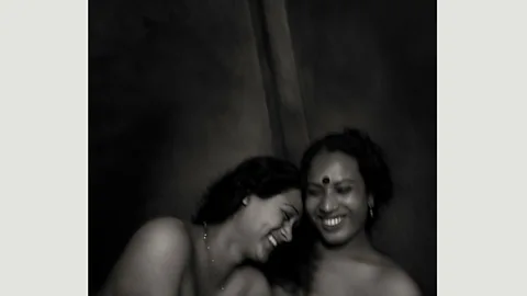 Shahria Sharmin Unable to return to their family homes, Shumi (22) and Priya’s (26) new life is subject to the rules of a guru – obedience in exchange for a new home (Credit: Shahria Sharmin)