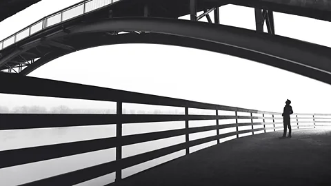 iStock Silhouette of man near bridge (Credit: iStock)
