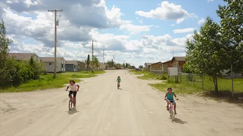 Eliana Alvarez Martinez Children ride bikes through Ilford, Manitoba, Canada (Credit: Eliana Alvarez Martinez)