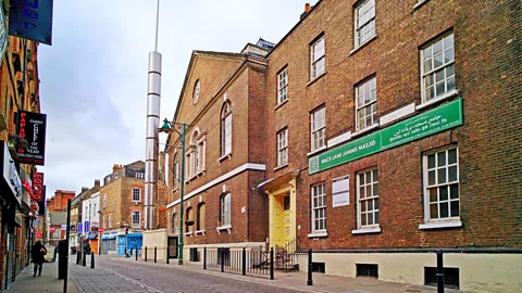 Alamy Now a mosque, 59 Brick Lane received a 29m-tall minaret in 2010 (Credit: Alamy)