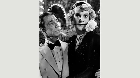 Alamy After an enchanted evening, Daphne (Lemmon) becomes engaged to elderly tycoon Osgood (Joe E Brown) (Credit: Alamy)