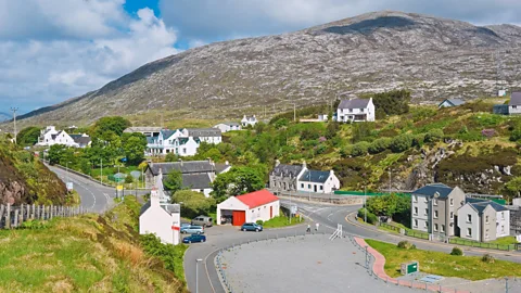 Alamy Studies have shown that living in smaller communities, like the Isle of Harris town of Tarbert (population: 500), can increase a sense of trust and belonging (Credit: Alamy)