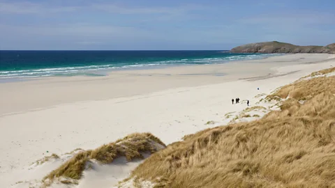 Alamy Outer Hebridean islands like the Isle of Barra may be beautiful – but they are also home to some of the UK’s happiest people (Credit: Alamy)