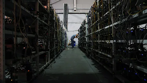 Getty Images Mining Bitcoin takes time and computer processing power, so it’s often done in massive farms such as this converted warehouse in Moscow, Russia (Credit: Getty Images)