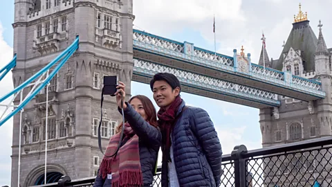 Getty Images A PwC study found 52% of of millennial holiday spending went on experience-related purchases such as travel and entertainment, versus 39% for older shoppers (Credit: Getty Images)