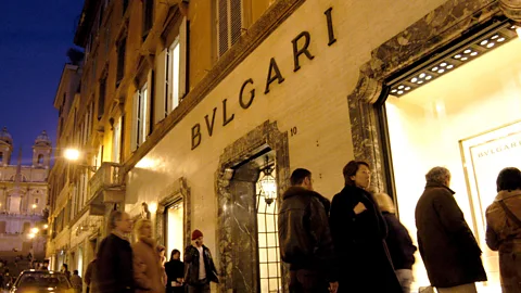 Getty Images Money left in the holiday budget: pay the bills or one last splurge? (Credit: Getty Images)