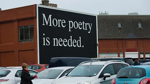 Alamy More Poetry is Needed billboard public art by Jeremy Deller in Swansea; Sieghart has spent 25 years trying to inject poetry into everyday lives (Credit: Alamy)