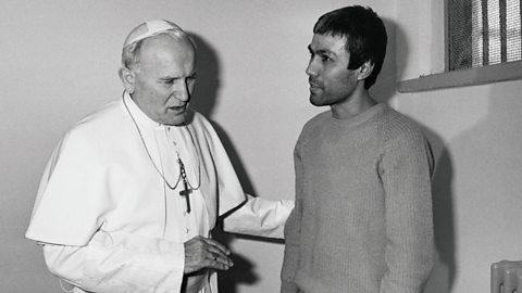 Pope John Paul II speaks with Mehmet Ali Agca