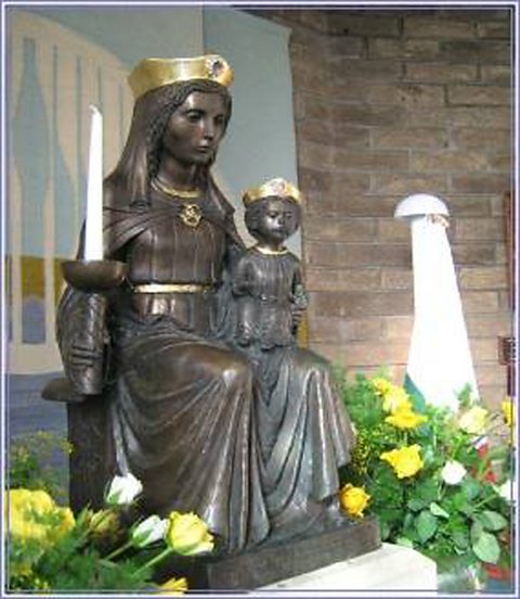 Statue of Our Lady of the Taper – Mary sitting with a small child on her lap and holding a candle in her right hand