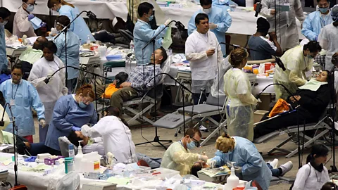Getty Images Medics working in free medical, dental and vision clinics must 'read' patients and assess quickly (Credit: Getty Images)