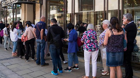 Customers queue outside a tearoom