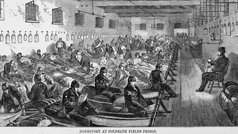 A drawing of a large room filled with prisoners sitting on hammock-type beds. A warder is sitting in a chair at the front of the room.