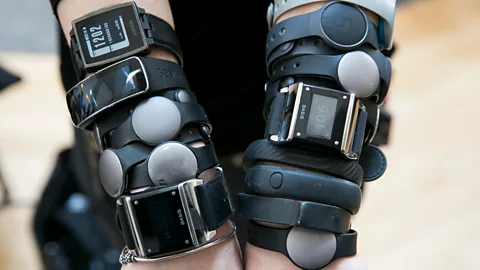 Alamy Under corporate wellness schemes, sensor-filled wristbands like FitBits and the Jawbone tracker are offered at subsidised prices, or even given out free. (Credit: Alamy)