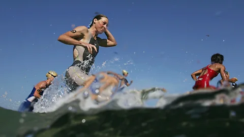 Getty Images Triathlon and Ironman contests are becoming popular as corporate fitness challenges (Credit: Getty Images)