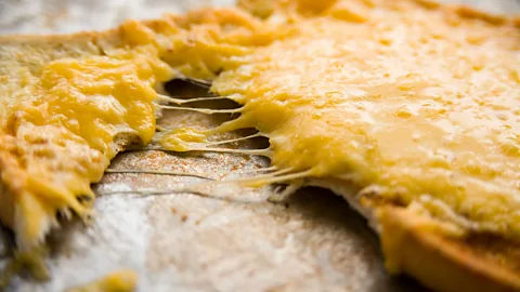 Alamy Oozing protein - like melted cheese - has a particularly powerful effect on us (Credit: Alamy)