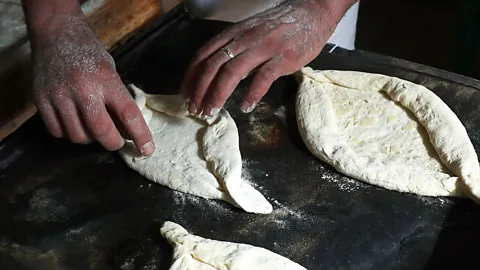 Adjaruli khachapuri is shaped to look like a boat (ITAR-TASS Photo Agency/Alamy)