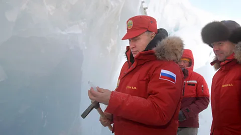 Getty Images Russian President Vladimir Putin next to Prime Minister Dmitry Medvedev as they visit the remote Arctic islands of Franz Josef Land on March 29, 2017 (Credit: Getty Images)