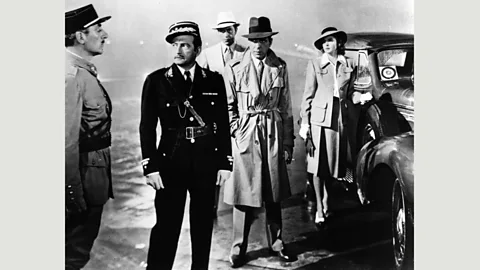 Alamy Police chief Renault (Claude Rains) exchanges exit visas for sexual favours – viewed initially in the film as a harmless game (Credit: Alamy)