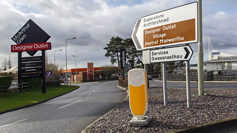 A roadside view of the entrance to the McArthurGlen out-of-town retail park near Bridgend, south Wales.