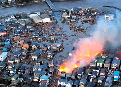 Aerial view of a fire in the flooded city of Iwaki, Fukushima Prefecture.