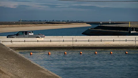Alamy Since its construction, this bridge over a canal in San Joaquin Valley has sunk about 1 metre (4ft) as the land has subsided (Credit: Alamy)
