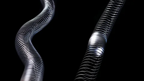 Alamy A slinky can be used to demonstrate two different types of seismic wave – the S wave on the left and the P wave on the right (Credit: Science Photo Library/Alamy)