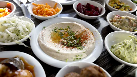 Vladimir Godnik /Getty Images Hummus b’tahini consists of chickpeas, tahini, garlic and lemon (Credit: Vladimir Godnik /Getty Images)