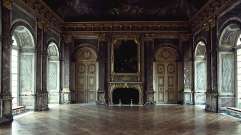 Getty Images The Salon d'Hercule, one of the many elaborate and extremely formal rooms within Louis XIV's Palace of Versailles (Credit: Getty Images)