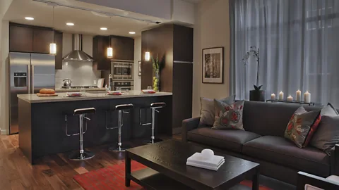 Getty Images As cities become more and more overcrowded, a room dedicated to relaxing and socialising has become a luxury few can afford (Credit: Getty Images)