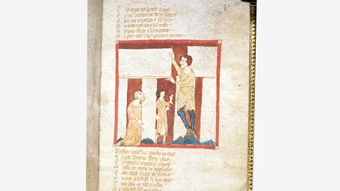 Wikimedia A giant helps Merlin build Stonehenge, from a 12th-Century manuscript of the Brut by Robert Wace – in Medieval Britain, ruins were associated with magic (Credit: Wikimedia)