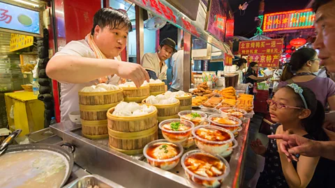 Edwin Remsberg/Getty Images Enjoying old-fashioned food can be an easy way to make local friends (Credit: Edwin Remsberg/Getty Images)