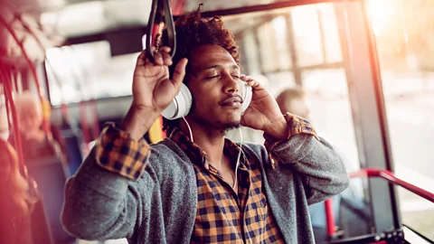 Getty Getting on public transport and pressing play, instead of automatically being sucked into social media, could be spiritually stabilising (Credit: Getty)
