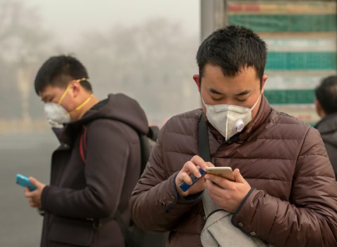 People wearing masks to protect against air pollution in Beijing