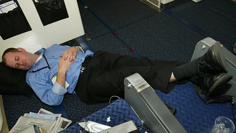 Getty Images Can't afford a lie-flat bed? There are other ways to get a good night's sleep that don't include stretching out on the floor (Credit: Getty Images)