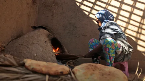 Chris Griffiths The traditional practice of cooking in a mud oven remains common (Credit: Chris Griffiths)