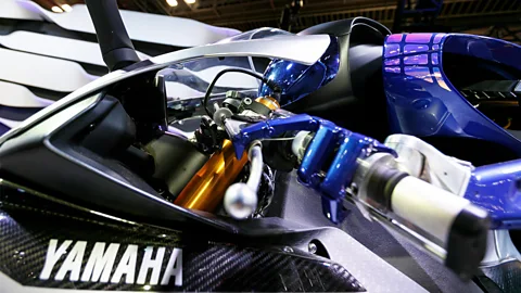 Alamy While Motobot is attached to the bike, it is required to grip and twist the throttle, as a human would (Credit: Alamy)