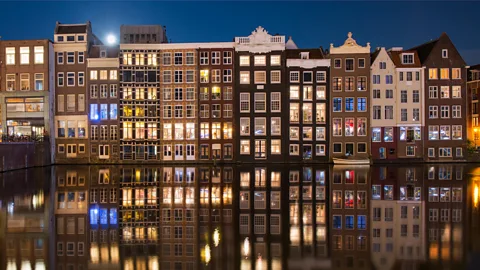 Inigo Cia/Getty Images Many of the older houses in the Netherlands have big windows, allowing ers-by to look inside (Credit: Inigo Cia/Getty Images)