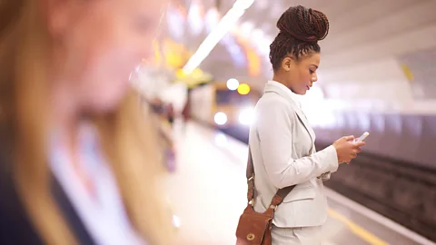 Getty A woman on her phone on London's tube (Credit: Getty)