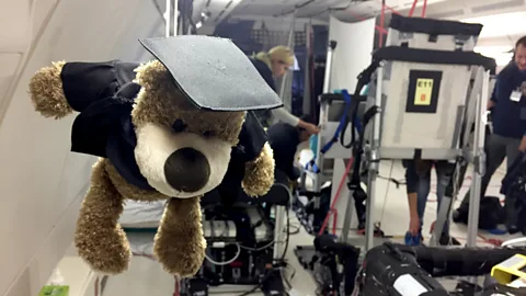 Sue Nelson Some experiments have mascots attached - which float into the air as weightlessness takes hold (Credit: Sue Nelson)