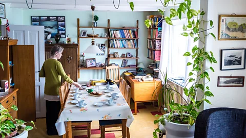 Lola Akinmade Åkerström Hermanda sets the table for tea in her cottage in Hestur (Credit: Lola Akinmade Åkerström)