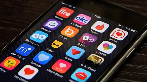 Getty Images A study by smartphone maker HTC into dating apps found that 24% of UK users kept their profile active even after they found a relationship ( Credit: Getty Images)