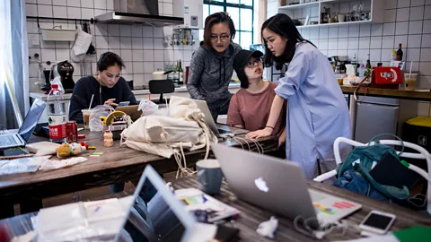 Johannes Eisele/AFP/Getty Images E-commerce startups in China are attracting many millennial workers, including many women (Credit: Getty Images)