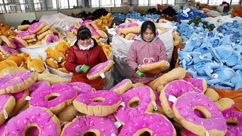 AFP/Getty Images This January 2018 photos shows Chinese employees creating toys at a factory in China's eastern Jiangsu province (Credit: Getty Images)